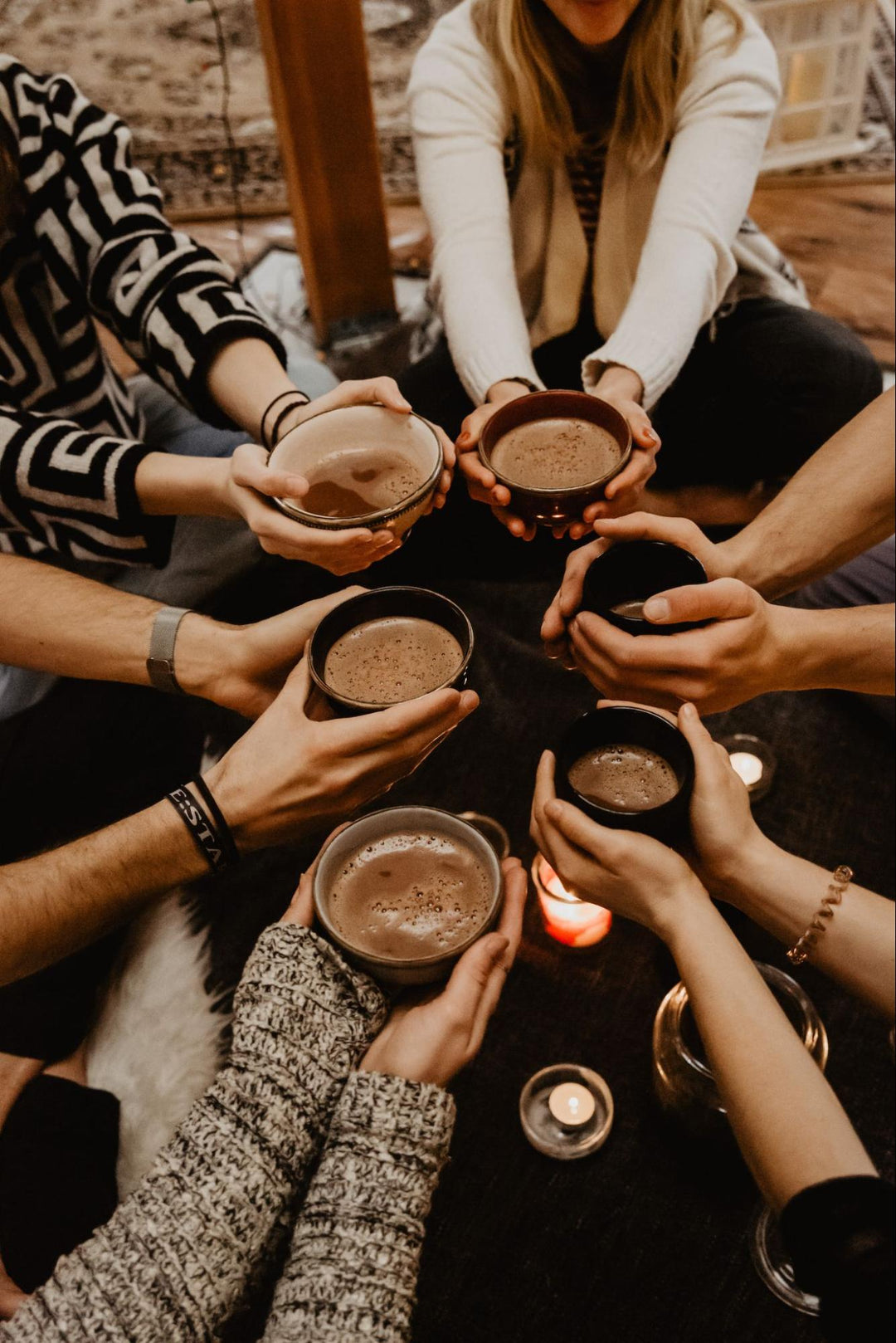 holding cacao ceremony cups
